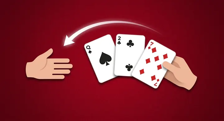 Three cards being passed face down to another player before the hand begins in Hearts